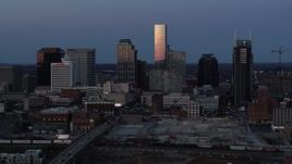 5.7K aerial stock footage of flying by the city's skyline at twilight in Downtown Nashville, Tennessee Aerial Stock Footage | DX0002_115_020