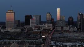 5.7K aerial stock footage light reflecting off skyscrapers in city's skyline, descend near Church Street at twilight in Downtown Nashville, Tennessee Aerial Stock Footage | DX0002_115_025