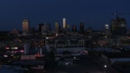 5.7K aerial stock footage wide view of skyscrapers reflecting light in the city skyline at twilight in Downtown Nashville, Tennessee Aerial Stock Footage | DX0002_115_032
