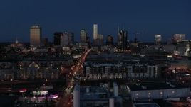 5.7K aerial stock footage ascend near Church Street to approach city skyline at twilight, Downtown Nashville, Tennessee Aerial Stock Footage | DX0002_115_035