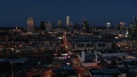 5.7K aerial stock footage flashing lights and traffic on Church Street and city skyline, Downtown Nashville, Tennessee Aerial Stock Footage | DX0002_115_039
