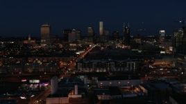 5.7K aerial stock footage descend and fly away from the city skyline at twilight, Downtown Nashville, Tennessee Aerial Stock Footage | DX0002_115_044