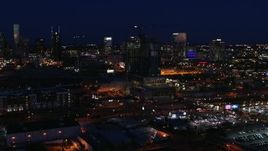 5.7K aerial stock footage flyby a high-rise building under construction at night, Downtown Nashville, Tennessee Aerial Stock Footage | DX0002_115_049