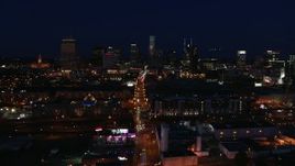 5.7K aerial stock footage flying by Church Street and the city skyline at night, Downtown Nashville, Tennessee Aerial Stock Footage | DX0002_115_050