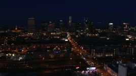 5.7K aerial stock footage following Church Street toward the city skyline at night, Downtown Nashville, Tennessee Aerial Stock Footage | DX0002_115_051
