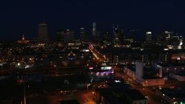 5.7K aerial stock footage flyby flashing lights on Church Street at night, skyline in background, Downtown Nashville, Tennessee Aerial Stock Footage | DX0002_115_054