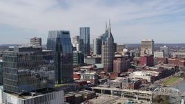 5.7K aerial stock footage of flying by skyscrapers and reveal an office high-rise in Downtown Nashville, Tennessee Aerial Stock Footage | DX0002_116_011