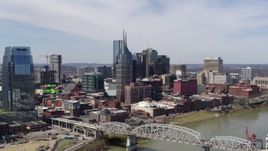 5.7K aerial stock footage approach AT&T Building near bridge and Cumberland River in Downtown Nashville, Tennessee Aerial Stock Footage | DX0002_116_014