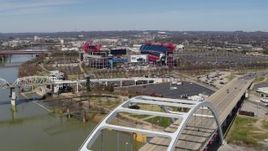 5.7K aerial stock footage of Nissan Stadium seen from a bridge in Nashville, Tennessee Aerial Stock Footage | DX0002_116_017