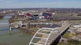 5.7K aerial stock footage of a wide orbit of Nissan Stadium, seen from near a bridge in Nashville, Tennessee Aerial Stock Footage | DX0002_116_021