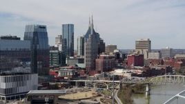 5.7K aerial stock footage ascend near bridge to focus on the AT&T Building in Downtown Nashville, Tennessee Aerial Stock Footage | DX0002_116_034