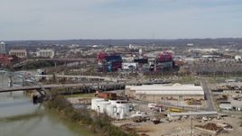 5.7K aerial stock footage of Nissan Stadium near bridge, seen from Cumberland River in Nashville, Tennessee Aerial Stock Footage | DX0002_116_042