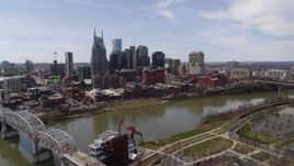 5.7K aerial stock footage of the city's riverfront skyscrapers on the opposite side of the river, Downtown Nashville, Tennessee Aerial Stock Footage | DX0002_117_001