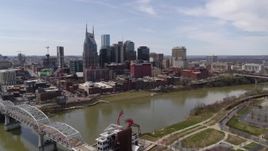 5.7K aerial stock footage of the city's riverfront skyscrapers on the opposite side of the river, Downtown Nashville, Tennessee Aerial Stock Footage | DX0002_117_003