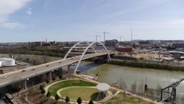 5.7K aerial stock footage orbiting the Korean War Veterans Memorial Bridge as cars cross in Nashville, Tennessee Aerial Stock Footage | DX0002_117_016