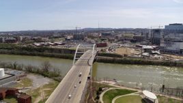 5.7K aerial stock footage ascend and orbit the Korean War Veterans Memorial Bridge as cars cross in Nashville, Tennessee Aerial Stock Footage | DX0002_117_017