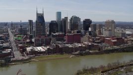 5.7K aerial stock footage slow orbit of the city's skyline across the Cumberland River, Downtown Nashville, Tennessee Aerial Stock Footage | DX0002_117_027