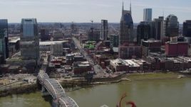 5.7K aerial stock footage crowded Broadway across the Cumberland River, Downtown Nashville, Tennessee Aerial Stock Footage | DX0002_117_029