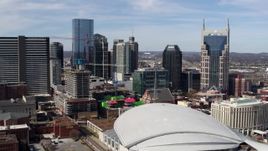 5.7K aerial stock footage of flying by city's skyline, seen from the arena, Downtown Nashville, Tennessee Aerial Stock Footage | DX0002_117_042