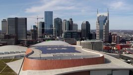 5.7K aerial stock footage of a view of the city's skyline, seen while descending by convention center, Downtown Nashville, Tennessee Aerial Stock Footage | DX0002_117_046