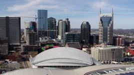 5.7K aerial stock footage of the city's skyline, Bridgestone Arena, and Hilton hotel, Downtown Nashville, Tennessee Aerial Stock Footage | DX0002_117_050