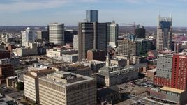 5.7K aerial stock footage of a reverse view of a high-rise hotel and skyscrapers in Downtown Nashville, Tennessee Aerial Stock Footage | DX0002_118_008
