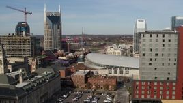 5.7K aerial stock footage flyby Broadway and Bridgestone Arena, reveal hotel in Downtown Nashville, Tennessee Aerial Stock Footage | DX0002_119_008