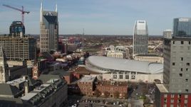 5.7K aerial stock footage flyby hotel to reveal Broadway and Bridgestone Arena, Downtown Nashville, Tennessee Aerial Stock Footage | DX0002_119_009
