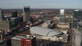 5.7K aerial stock footage approach Bridgestone Arena between AT&T Building, Pinnacle skyscraper, Downtown Nashville, Tennessee Aerial Stock Footage | DX0002_119_015