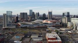 5.7K aerial stock footage ascend and flyby Nashville Music City Center and city's skyline, Downtown Nashville, Tennessee Aerial Stock Footage | DX0002_119_021