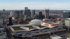 5.7K aerial stock footage slow approach to Nashville Music City Center and city's skyline, Downtown Nashville, Tennessee Aerial Stock Footage | DX0002_119_023