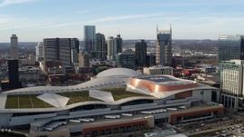 5.7K aerial stock footage flyby and away from Nashville Music City Center and city's skyline, Downtown Nashville, Tennessee Aerial Stock Footage | DX0002_119_027