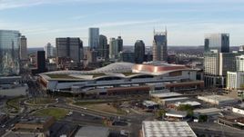 5.7K aerial stock footage ascend and flyby Nashville Music City Center and city's skyline, Downtown Nashville, Tennessee Aerial Stock Footage | DX0002_119_029