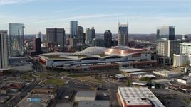 5.7K aerial stock footage reverse view of Nashville Music City Center and city's skyline during descent, Downtown Nashville, Tennessee Aerial Stock Footage | DX0002_119_030