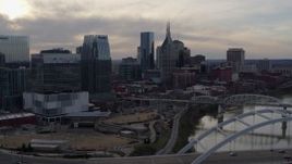 5.7K aerial stock footage of the AT&T Building and city skyscrapers at sunset, Downtown Nashville, Tennessee Aerial Stock Footage | DX0002_119_036