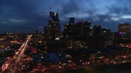 5.7K aerial stock footage of a wide orbit of the AT&T Building and city skyline at twilight, Downtown Nashville, Tennessee Aerial Stock Footage | DX0002_121_006