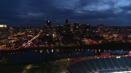 5.7K aerial stock footage reverse view of city's skyline and river, seen from stadium at twilight, Downtown Nashville, Tennessee Aerial Stock Footage | DX0002_121_009