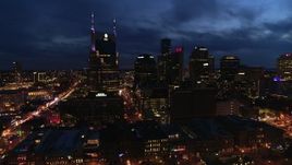 5.7K aerial stock footage reverse view of AT&T Building and skyline at twilight, Downtown Nashville, Tennessee Aerial Stock Footage | DX0002_121_012