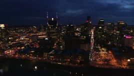 5.7K aerial stock footage city skyline at twilight, cross river toward AT&T Building, Downtown Nashville, Tennessee Aerial Stock Footage | DX0002_121_014