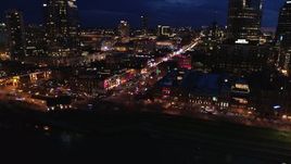 5.7K aerial stock footage of orbiting the river end of Broadway at twilight, Downtown Nashville, Tennessee Aerial Stock Footage | DX0002_121_015