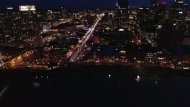 5.7K aerial stock footage fly away from Broadway and traffic at twilight, reveal skyscrapers, Downtown Nashville, Tennessee Aerial Stock Footage | DX0002_121_018