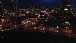 5.7K aerial stock footage of flying toward Broadway and traffic at twilight, Downtown Nashville, Tennessee Aerial Stock Footage | DX0002_121_019