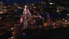 5.7K aerial stock footage of orbiting the end of Broadway with traffic at twilight, Downtown Nashville, Tennessee Aerial Stock Footage | DX0002_121_020