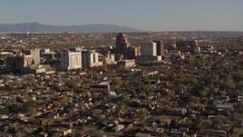 5.7K aerial stock footage of the city's high-rises seen while ascending near residential neighborhoods in Downtown Albuquerque, New Mexico Aerial Stock Footage | DX0002_122_003