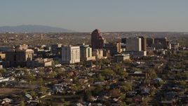 5.7K aerial stock footage of passing by the city's office high-rises, Downtown Albuquerque, New Mexico Aerial Stock Footage | DX0002_122_016
