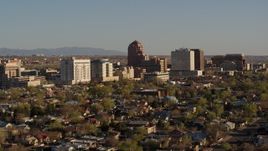 5.7K aerial stock footage of passing the office high-rise buildings and descend in Downtown Albuquerque, New Mexico Aerial Stock Footage | DX0002_122_020