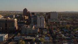 5.7K aerial stock footage of flying by a courthouse and office high-rise buildings in Downtown Albuquerque, New Mexico Aerial Stock Footage | DX0002_122_021