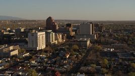 5.7K aerial stock footage of passing by office high-rise buildings and ascend in Downtown Albuquerque, New Mexico Aerial Stock Footage | DX0002_122_023