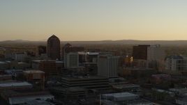 5.7K aerial stock footage approach and flyby high-rise office buildings at sunset, Downtown Albuquerque, New Mexico Aerial Stock Footage | DX0002_122_033