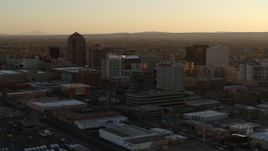 5.7K aerial stock footage of slowly flying by high-rise office buildings at sunset, Downtown Albuquerque, New Mexico Aerial Stock Footage | DX0002_122_036